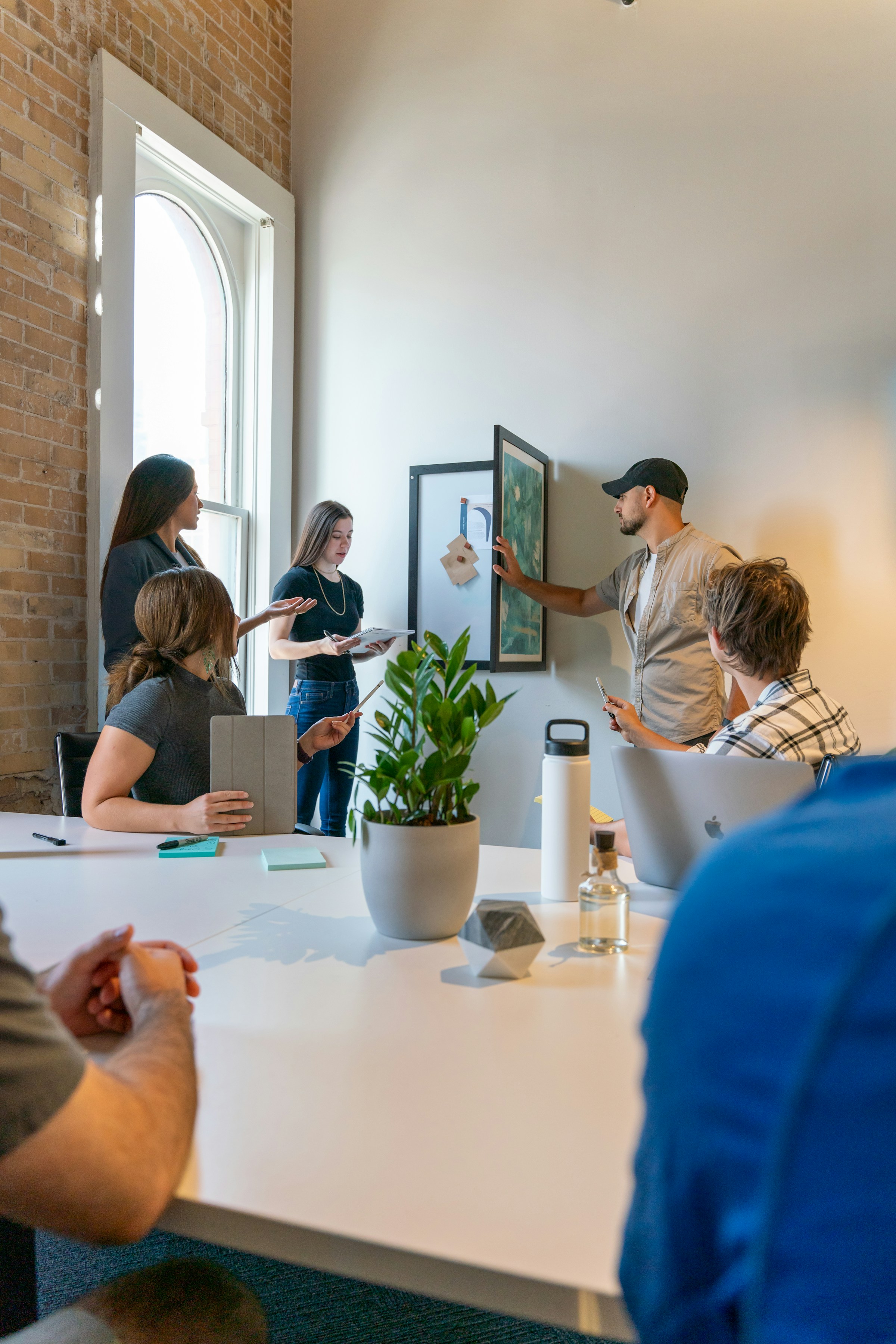 Team collaborating in a strategy session. Photo by Sable Flow on Unsplash.